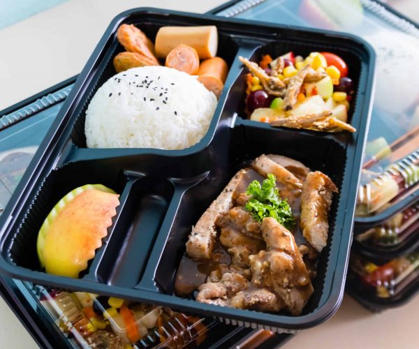 Ready to eat asian rice box, Thai food in take away plastic boxes.