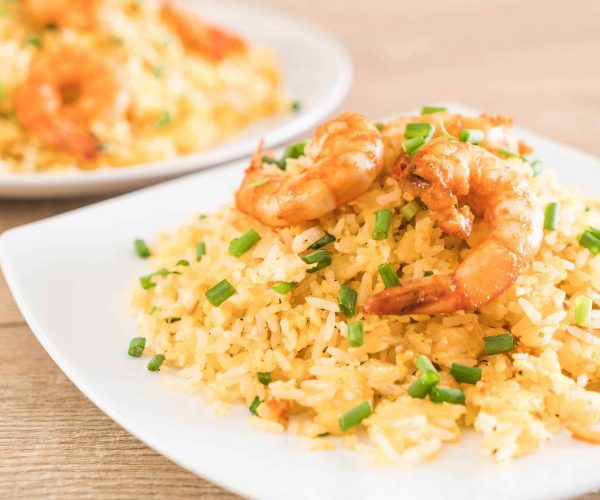 fried rice with shrimps on white plate